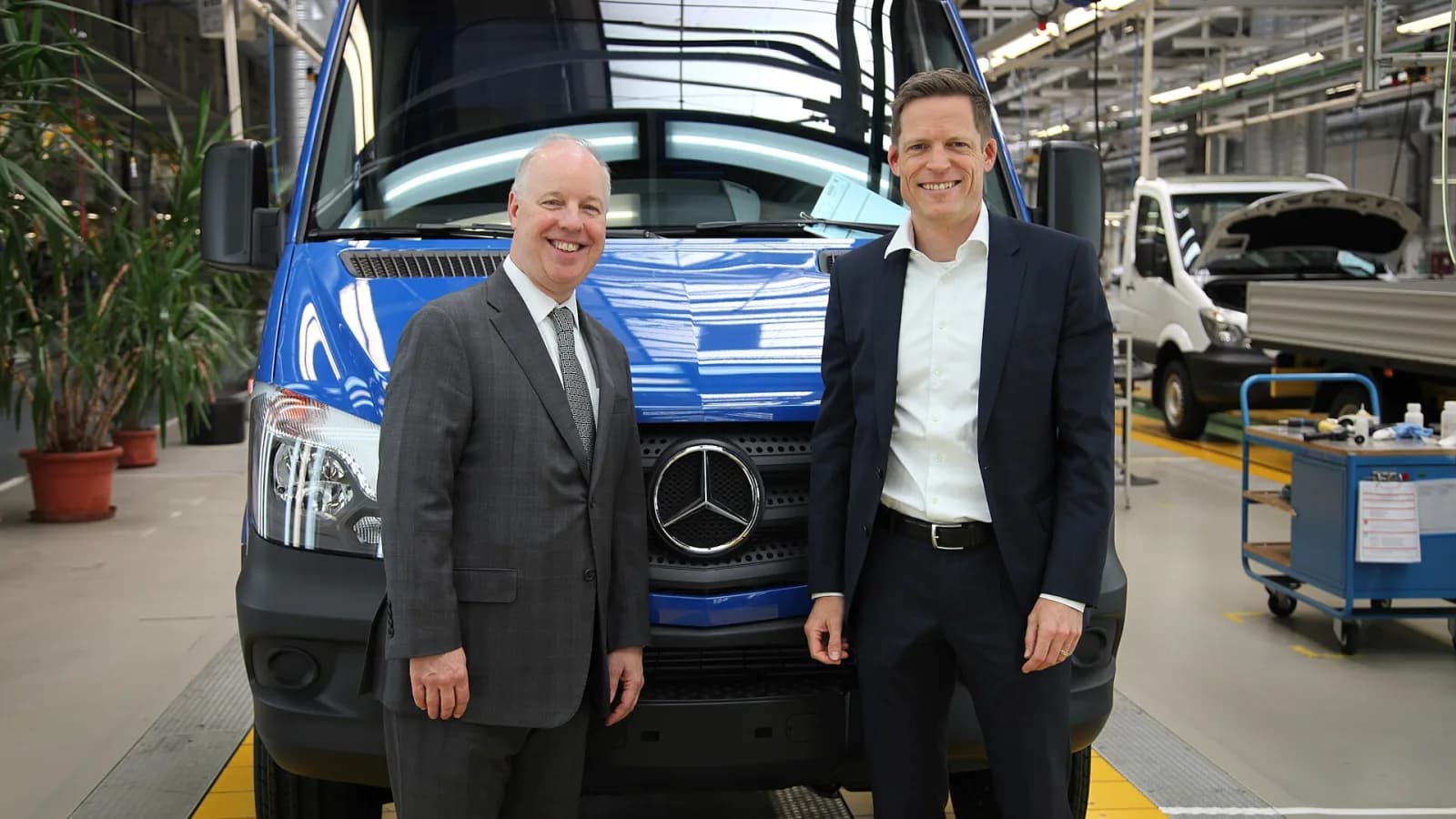 Factory exterior and workers at Mercedes-Benz Hungary plant